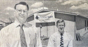 Wade Gort and Greg Westra in front of the original Premier Bank building